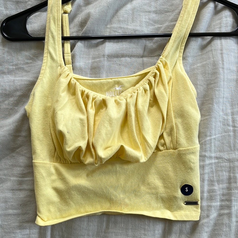 hollister yellow tank top! never worn, still has tags on it!